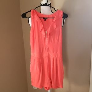 Express sleeveless romper with quarter zip